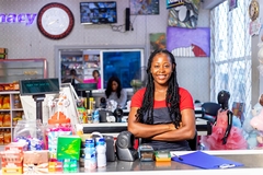 African woman working in supermarket.