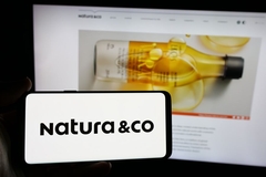 Image natura logo on phone and website in background