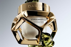 Image perfume bottle with golden cage structure around it