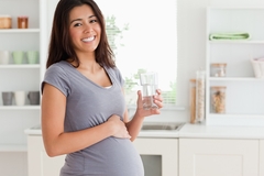 Image Pregnant woman drinking clear whey protein
