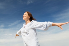 Image happy smiling woman enjoying weather with arms out