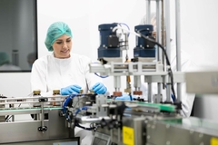 Image Woman working in a supplmeent factory