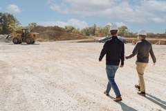 Image men walking on dusty sand
