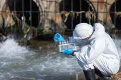 Image scientist collecting water samples