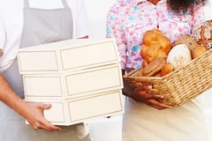 Image Two people holding baskets of bread and boxes of food