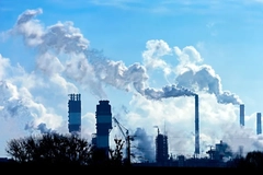 Image industrial pollution smoke in blue sky