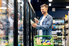 Image Man looking at food in the supermarket.