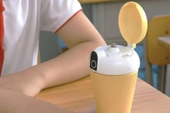Image A student using a water bottle