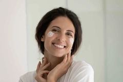 Image latin american woman using skin care