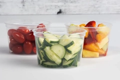 Image A group of plastic containers of fruit and vegetables