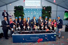 Image people at a groundbreaking event wearing construction worker hats