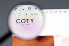 coty logo under magnifying glass on computer screen