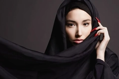 woman wearing hijab with red nails