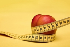 Apple and measuring tape
