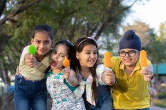 Image four indian children with ice creams