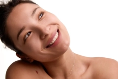 korean woman smiling with her head tilting