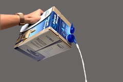 Image A hand pouring liquid out of a carton
