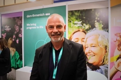 Image man standing by the dsm-firmenich booth at SEPAWA 2025