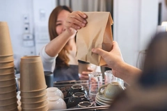Image woman holding paper bag