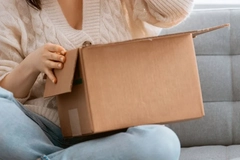 Image A person opening a box