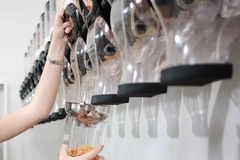 Image A person pouring cereal into a container