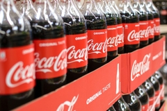Coca-Cola bottles on the shelves.