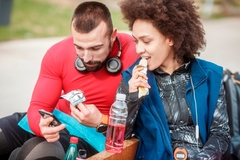 Image Man and woman eating snacks with functional food ingredients.