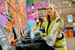 Image Woman recycles plastic packaging