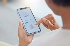 Image Someone buying beauty products on their phone.