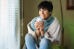 Image Menopausal woman drinking tea