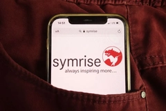 Image symrise logo on phone screen in pocket of pants
