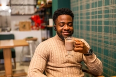 Image Man enjoying a hot chocolate