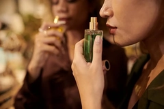 Image woman using perfume bottle