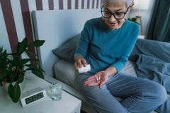 Image Woman taking a sleep supplement