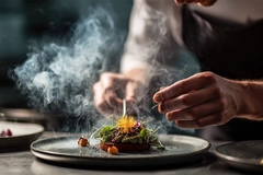 Image Chef preparing dish with new flavors.