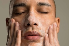 Image man washing face with cleanser