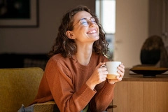 Image Cheerful woman enjoying coffee cup in a winter afternoon