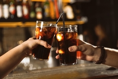 Image Two people drinking soda.