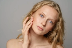 Image young woman using skin care