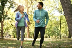 Image Man and woman running outside