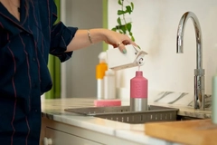 Image woman refilling bottle