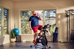 Image Man sitting on a workout bike