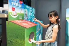 Image A girl returning toothpaste tube.