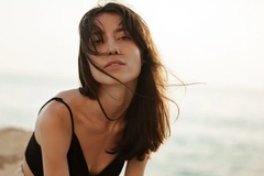 woman on the beach smiling
