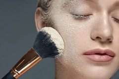 Image woman with powder and brush on face