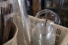 Close-up of plastic cups and straws