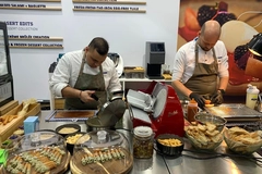 two male chefs at trade show booth