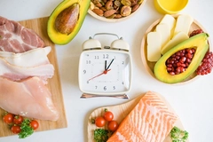 A clock on a plate of food