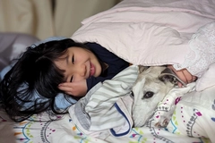 Image Girl cuddling with her dog_