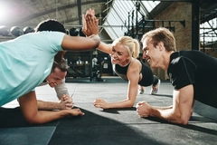 Friends exercising in the gym